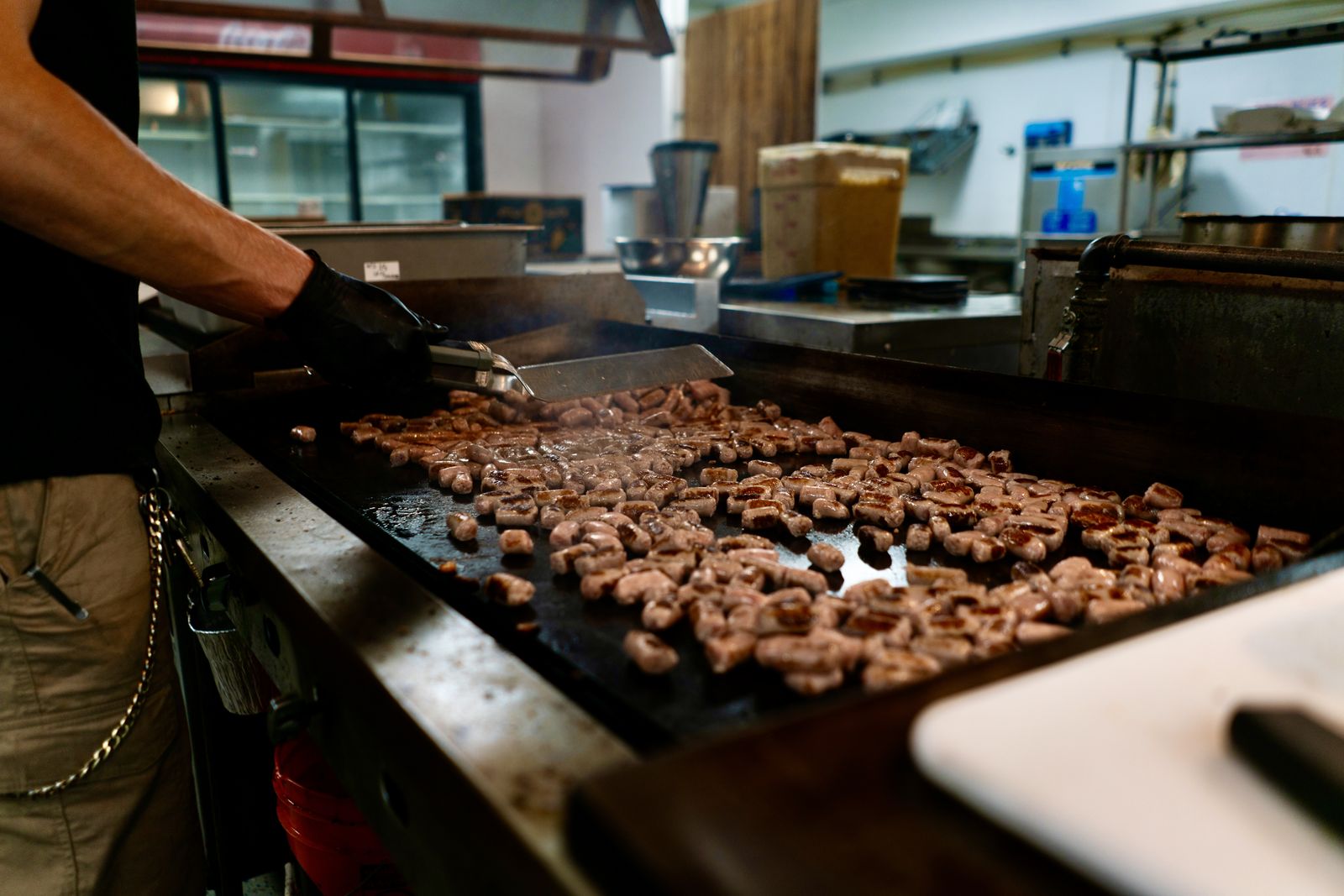 Sausage sizzling on the flat-top